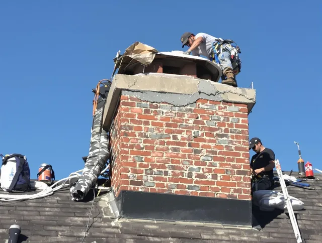New Fairfield Chimney Sweep installing a custom chimney crown in New Fairfield, CT