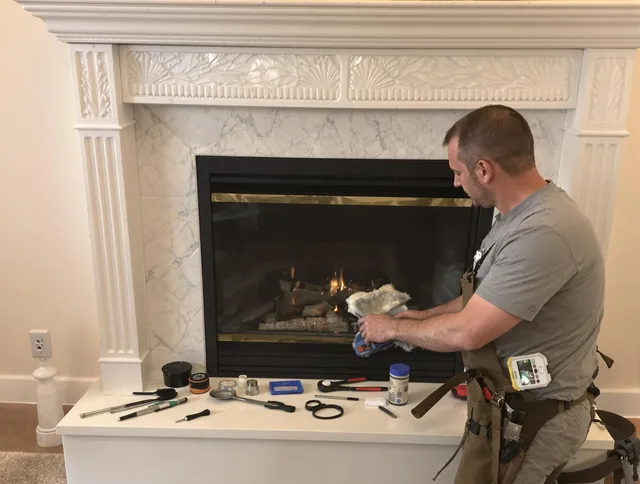 New Fairfield Chimney Sweep performing fireplace maintenance in New Fairfield, CT